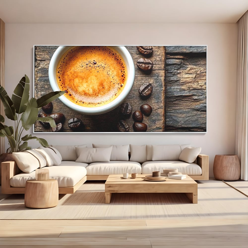 Tablou canvas cu ceasca de espresso si boabe de cafea, in rama de aluminiu argintiu, pe perete intr-un living